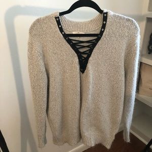 Gray sweater with black tie accent